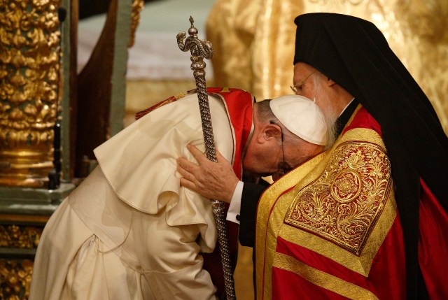 Pope Francis, Ecumenical Patriarch Bartholomew of Constantinople embrace during prayer service in Istanbul
